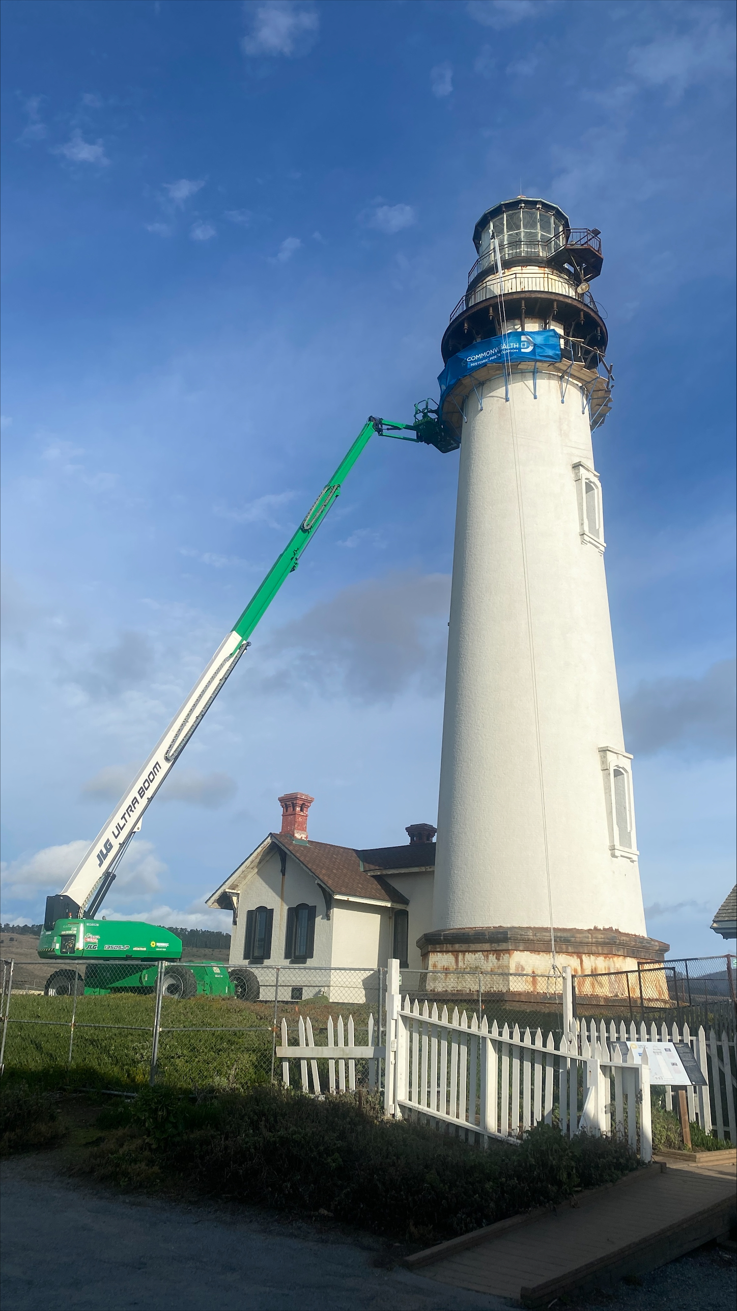 Crane reaching top of tower at Pigeon Point